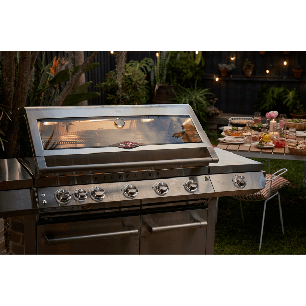 BEEFEATER 7000 PREMIUM 5 BURNER BBQ SIDE BURNER TROLLEY IN SITU GARDEN NIGHT